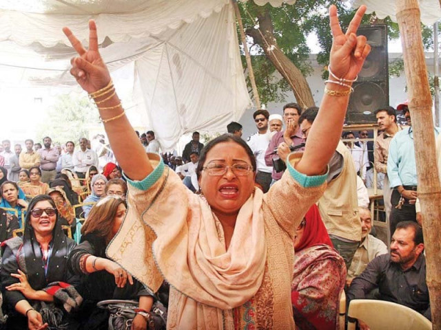 women shout slogans during a sit in protest by pia employees photo afp women shout slogans during a sit in protest by pia employees photo afp