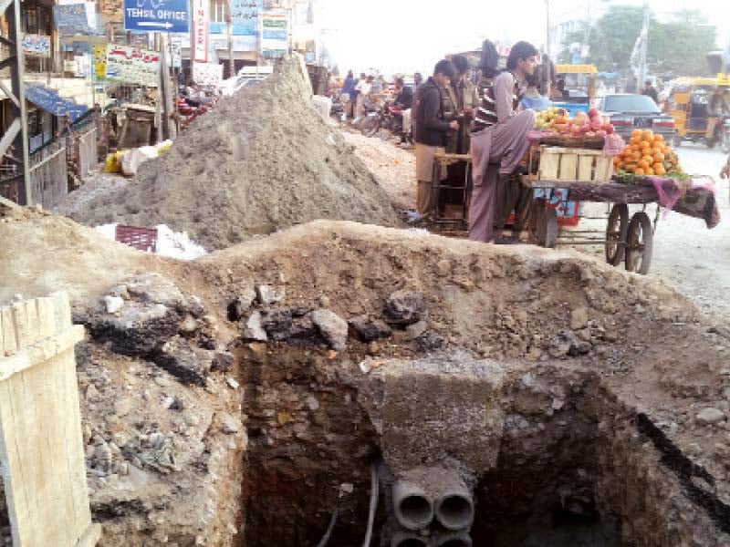 a road in chakwal city dug up for sewerage maintenance work photo express