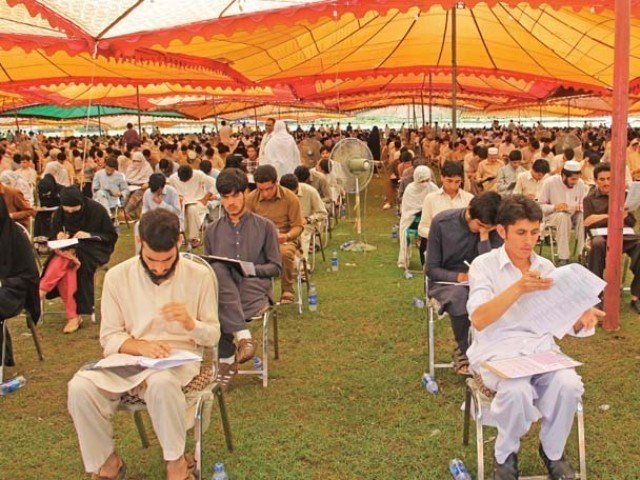 students take the medical and dental colleges entrance tests under sprawling tents at grassy ground saidu sharif photo express file