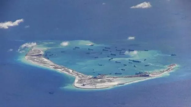 chinese dredging vessels are purportedly seen in the waters around mischief reef in the disputed spratly islands in the south china sea in this still image from video taken by a p 8a poseidon surveillance aircraft provided by the united states navy may 21 2015 photo reuters