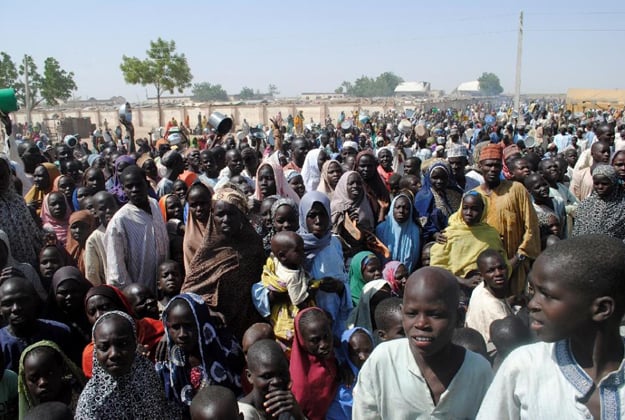 nternally displaced persons stand waiting for food at dikwa camp in borno state in north eastern nigeria on february 2 2016 photo afp