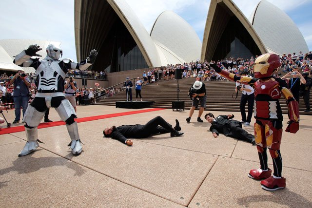 a handout photo taken and received on february 11 2016 shows nine year old domenic pace r acting out a scene as he is granted his wish to become a superhero like iron man with police staging an elaborate event on the sydney opera house steps as hollywood star robert downey jr tweeted his support photo afp