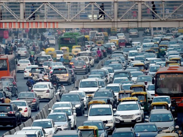 in this photograph taken on october 15 2015 commuters in their vehicles clog the roads of new delhi photo afp