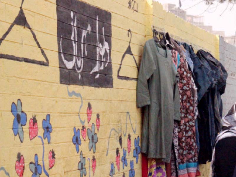 donated clothes are hanged on the wall photo amel ghani express