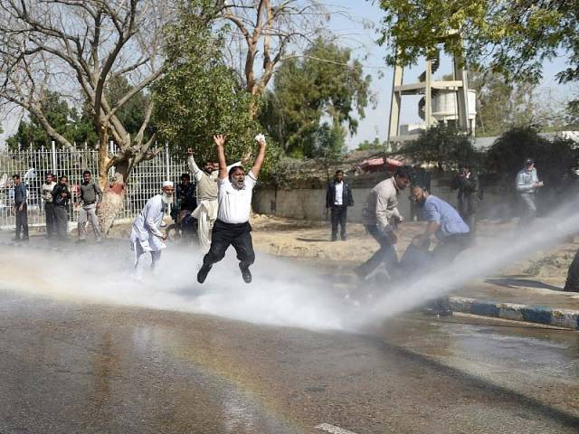 pia employees shout slogans as police use a water cannon on them during a protest near the karachi airport on february 2 2016 photo afp pia employees shout slogans as police use a water cannon on them during a protest near the karachi airport on february 2 2016 photo afp