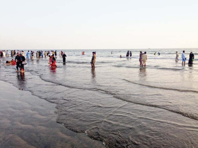 a large number of people turned up at the clifton beach despite the chilly weather and the ban on swimming on valentine s day photo express a large number of people turned up at the clifton beach despite the chilly weather and the ban on swimming on valentine s day photo express