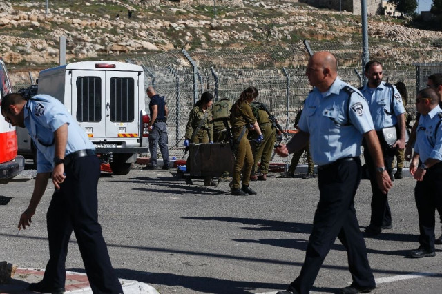 israeli security forces gather at the site of an attack at a checkpoint near the israeli settlement of har homa in the occupied west bank on february 14 2016 photo afp israeli security forces gather at the site of an attack at a checkpoint near the israeli settlement of har homa in the occupied west bank on february 14 2016 photo afp