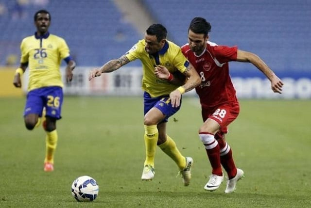fabian larry estoyanoff c of saudi arabia 039 s al naser fights for the ball with ahmad noorollahi of iran 039 s persepolis during their afc champions league soccer match at king fahad stadium in riyadh march 17 2015 fabian larry estoyanoff c of saudi arabia 039 s al naser fights for the ball with ahmad noorollahi of iran 039 s persepolis during their afc champions league soccer match at king fahad stadium in riyadh march 17 2015