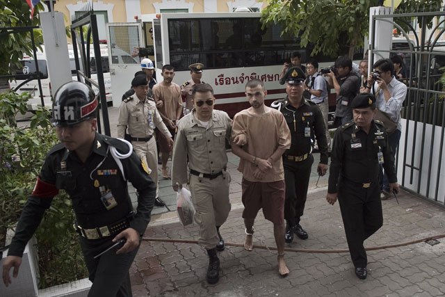 foreign suspects in the august 17 erawan shrine bombing identified by the ruling junta as adem karadag c and yusufu mieraili c back l arrive at a military court in bangkok on february 16 2016 the two uighurs accused over last year 039 s deadly bombing are set to enter a plea at a military court photo afp