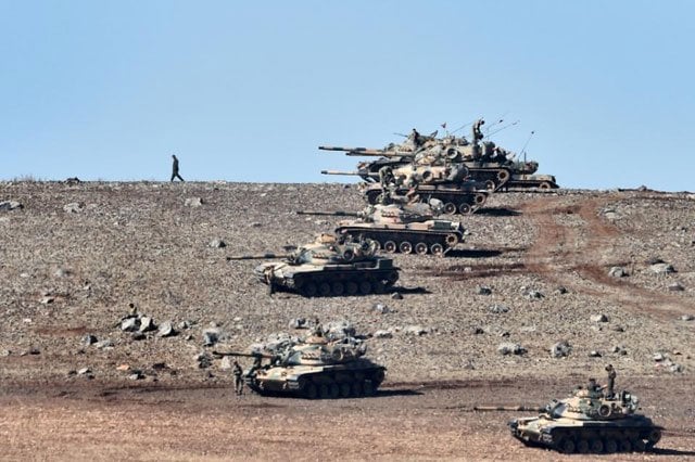 turkish tanks line up on a hill near the border with syria as islamic state militants besieged kobane in 2014 photo afp