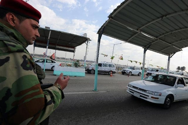 a member of the iraqi security forces mans a checkpoint on the main road from baghdad 039 s central jaderiyah district to dura on january 18 2016 photo afp a member of the iraqi security forces mans a checkpoint on the main road from baghdad 039 s central jaderiyah district to dura on january 18 2016 photo afp