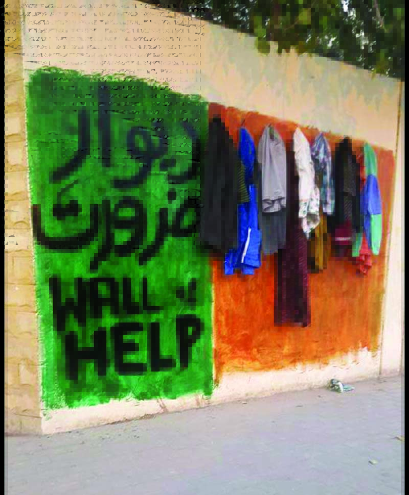 two a level students set up wall of help to serve karachi s poor for free