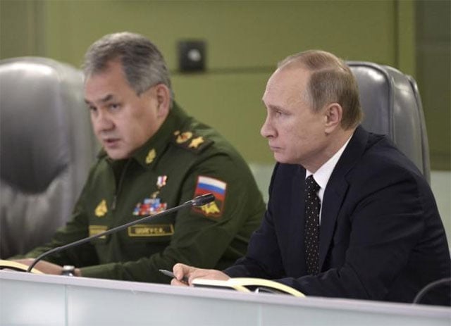 russian president vladimir putin r with defence minister sergei shoigu photo reuters