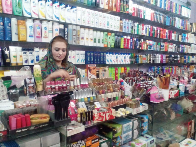 sonia arranges cosmetics for display at her shop in the city photo express sonia arranges cosmetics for display at her shop in the city photo express