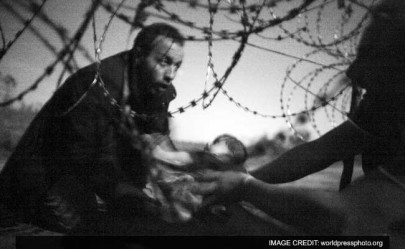image of baby at barbed wire fence wins world press photo image of baby at barbed wire fence wins world press photo