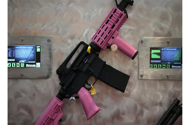 an assault rifle with pink highlights is displayed during a national rifle association annual meeting in houston texas photo afp an assault rifle with pink highlights is displayed during a national rifle association annual meeting in houston texas photo afp