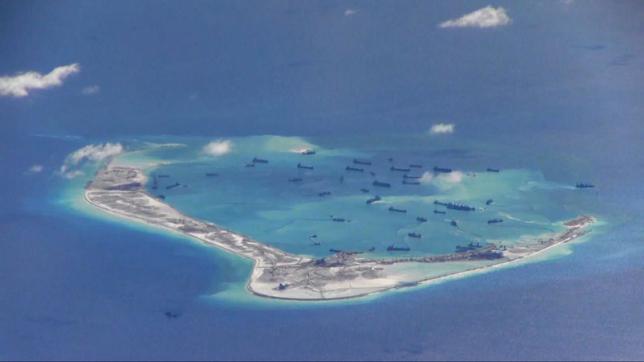 chinese dredging vessels are purportedly seen in the waters around mischief reef in the disputed spratly islands in the south china sea may 21 2015 photo reuters