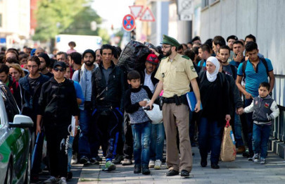german minister warns countries not to push refugee burden onto germany
