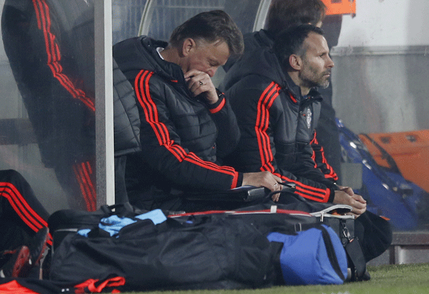 manchester united manager louis van gaal looks dejected with assistant manager ryan giggs photo reuters