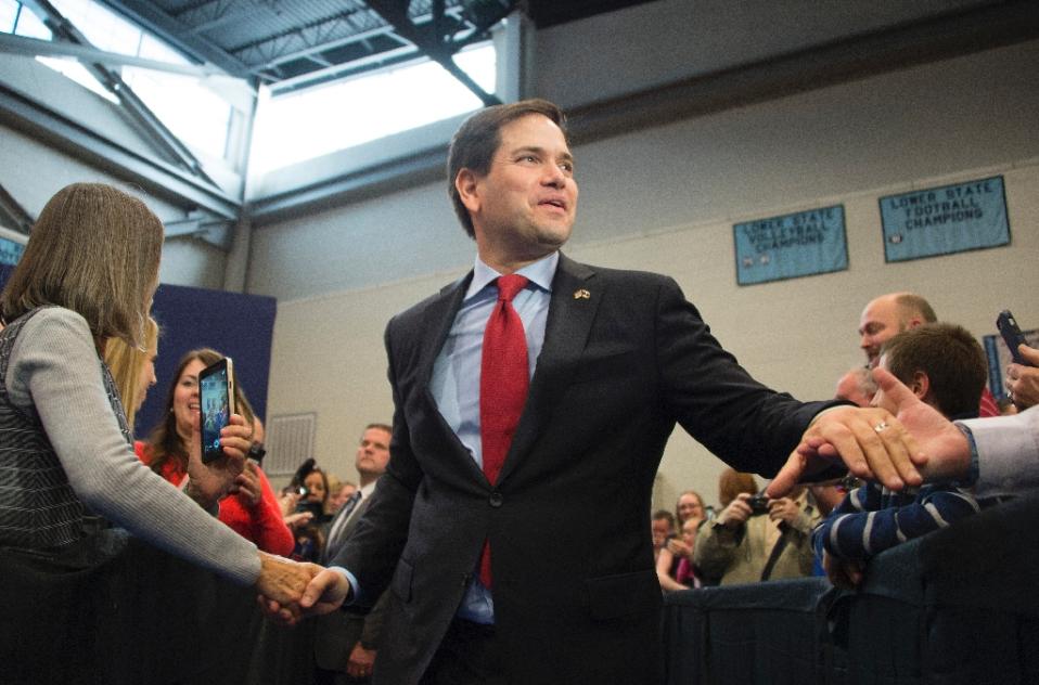 republican presidential candidate marco rubio greets supporters as he arrives to speak during a campaign rally in north charleston south carolina photo afp