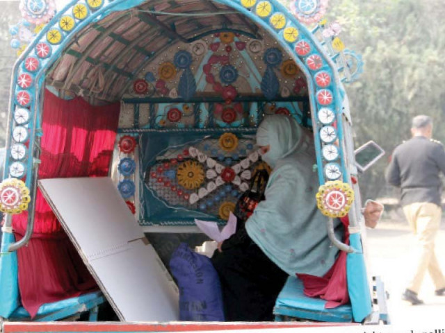 staff carries equipment to polling stations for by elections in peshawar photo ppi staff carries equipment to polling stations for by elections in peshawar photo ppi