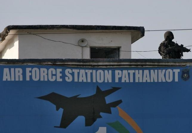 an indian security personnel stands guard on a building at iaf base at pathankot photo reuters