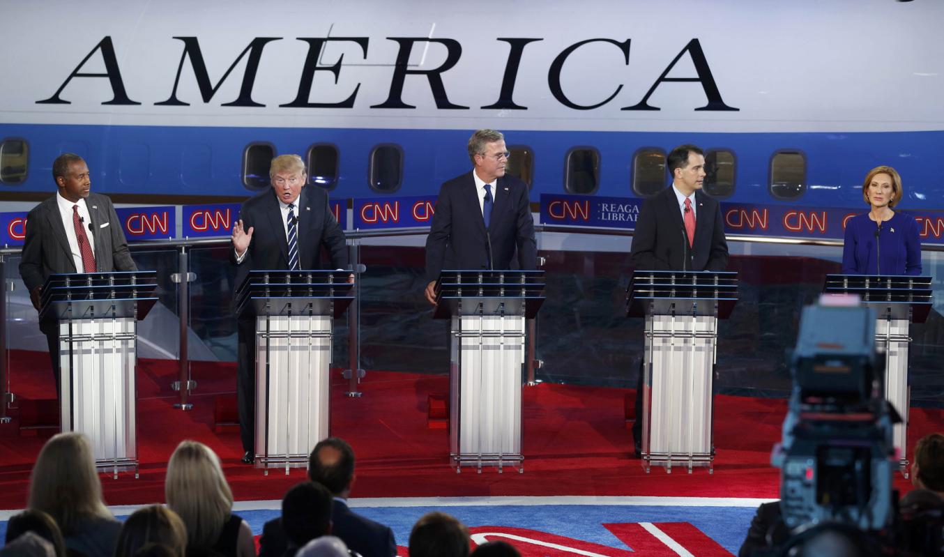 republican us presidential candidate dr ben carson l watches businessman donald trump 2nd l criticise the business record of former hp ceo carly fiorina far r as former florida governor jeb bush c and wisconsin governor scott walker look over to fiorina during the second official republican presidential candidates debate of the 2016 us presidential campaign at the ronald reagan presidential library in simi valley california united states september 16 2015 photo reuters