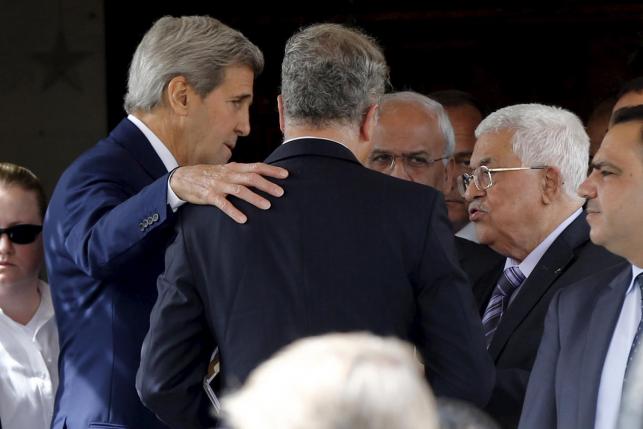 us secretary of state john kerry speaks with palestinian president mahmoud abbas after their meeting at abbas 039 residence in amman photo reuters