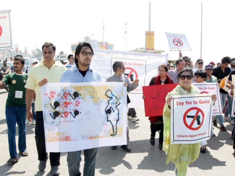 residents of karachi stepped out on sunday morning to draw awareness to their anti weapon movement the participants of the walk against weapons want to see a gun free pakistan photo aysha saleem express