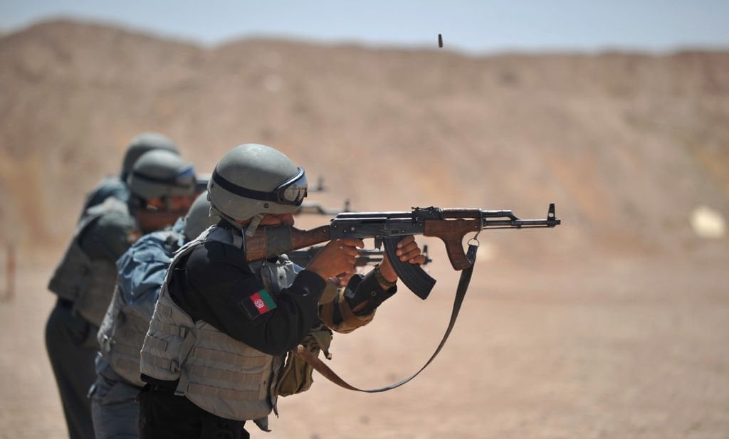 members of the afghanistan national policemen fire their ak 47 rifles during a shooting course taught by us marines at camp leatherneck in helmand province on june 19 2012 photo afp