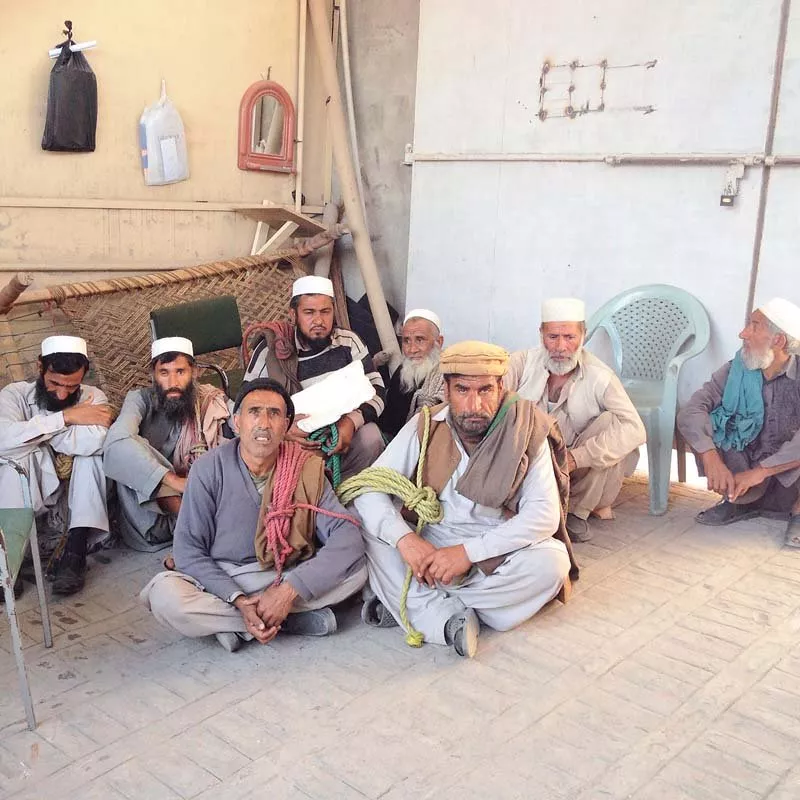 labourers sit at the entrance of peshawar press club photo express labourers sit at the entrance of peshawar press club photo express