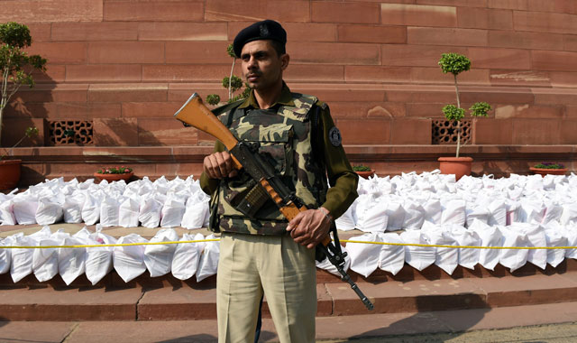 an indian central reserve police force crpf soldier stands guard over railway budget documents at parliament house in new delhi on february 25 2016 ahead of the release of the railways budget by railways minister suresh prabhu photo afp