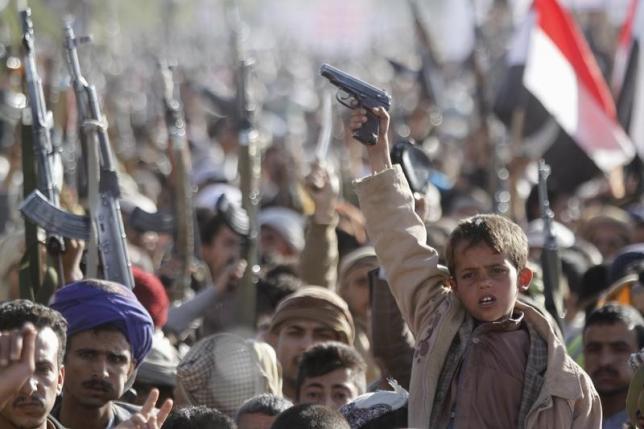 a boy shouts slogans as he raises a gun during a rally against us support to saudi led air strikes in yemen 039 s capital sanaa on february 19 2016 photo reuters