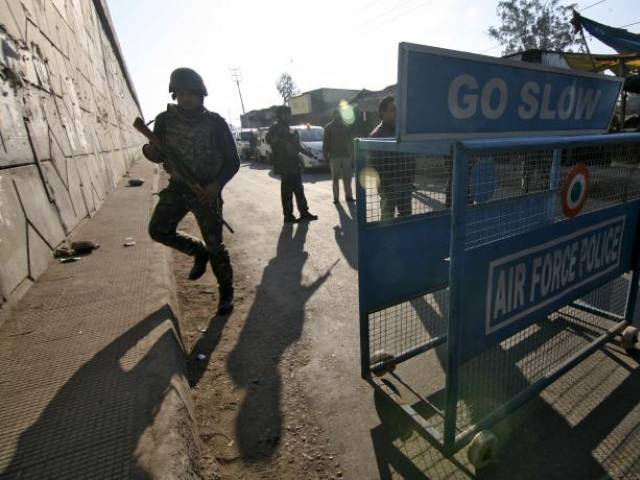 indian security personnel stand guard next to a barricade outside the indian air force iaf base at pathankot in punjab india january 2 2016 photo reuters