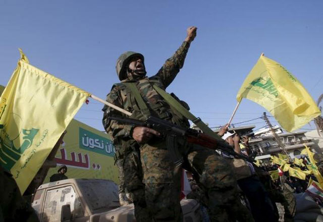 a hezbollah member reacts while hezbollah leader sayyed hassan nasrallah talks on a screen during a televised speech at a festival celebrating resistance and liberation day in nabatiyeh may 24 2015 photo reuters