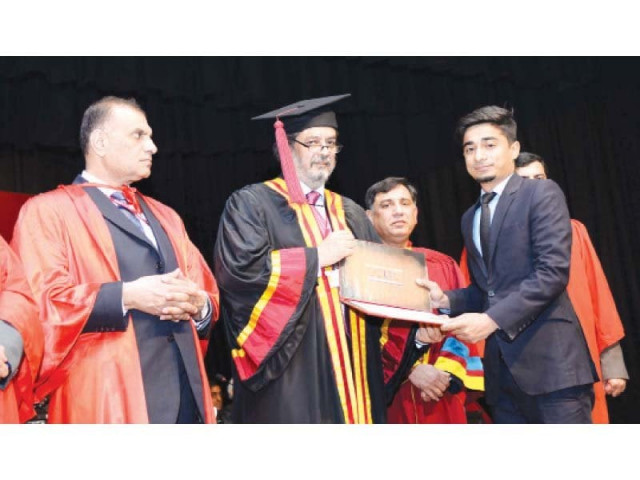 gcu vice chancellor hasan amir shah gives an award to a graduate on the second day of the university s convocation photo abid nawaz express
