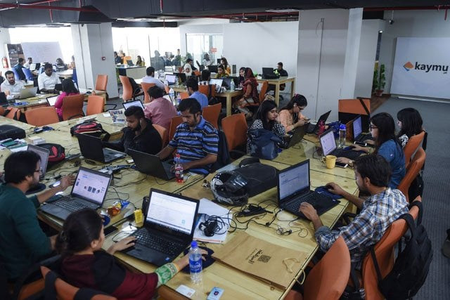 this photograph taken on november 19 2015 shows pakistani employees of online marketplace company at work in karachi photo afp