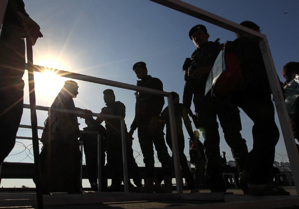 iraqi security forces guard a checkpoint in baghdad 039 s dora district photo afp