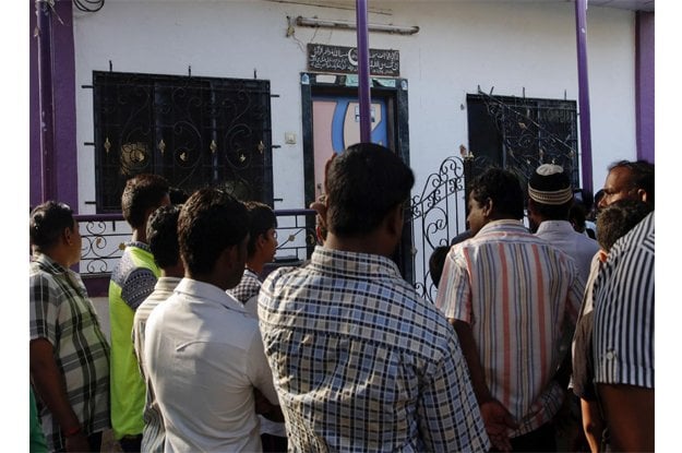 people gather outside the residence of indian man hasnain warekar in thane outskirts of mumbai india sunday feb 28 2016 photo afp