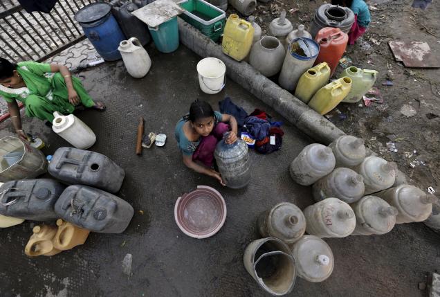 a girl waits to fill water in her containers from a municipal tap in new delhi india february 21 2016 photo reuters