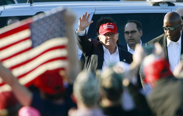 us republican presidential candidate donald trump waves as he arrives at the rally at madison city schools stadium in madison alabama on february 28 2016 photo reuters