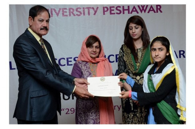 special assistant to chief minister on information and higher education mushtaq ghani distributing certificate among the participants of english access microscholarships programme photo inp special assistant to chief minister on information and higher education mushtaq ghani distributing certificate among the participants of english access microscholarships programme photo inp