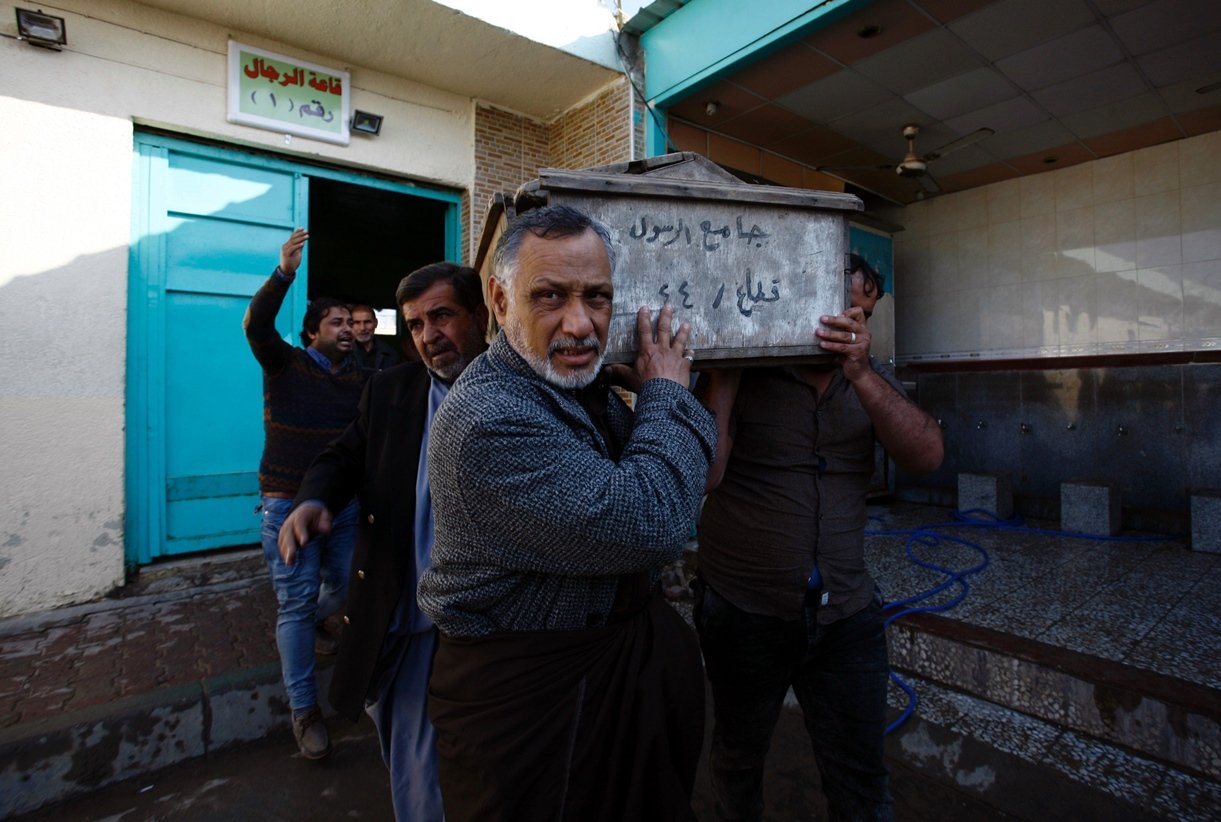 iraqi mourners carry a coffin during the funeral of victims of bombings the previous day in baghdad 039 s mostly shiite sadr city district on february 29 2016 in the city of najaf photo afp