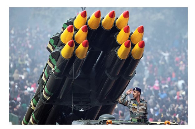 an indian soldier salutes as he rides a smerch rocket launcher during india 039 s republic day parade photo afp