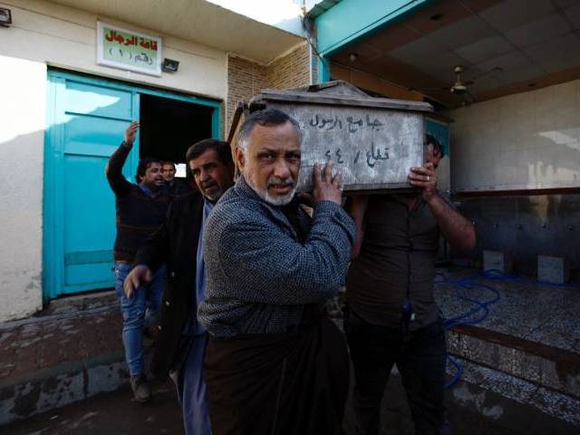 iraqi mourners carry a coffin during the funeral of victims of bombings the previous day in baghdad 039 s mostly shia sadr city district on february 29 2016 in the city of najaf photo afp