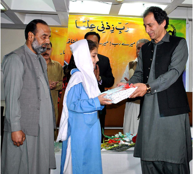 minister of elementary and secondary education muhammad atif distributed these books to students photo online