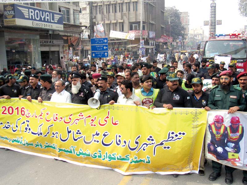 rescue 1122 officials lead a rally to raise awareness about civil defence in rahim yar khan photo express