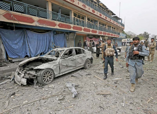 policemen inspect the site of a blast near the indian consulate in jalalabad photo reuters policemen inspect the site of a blast near the indian consulate in jalalabad photo reuters