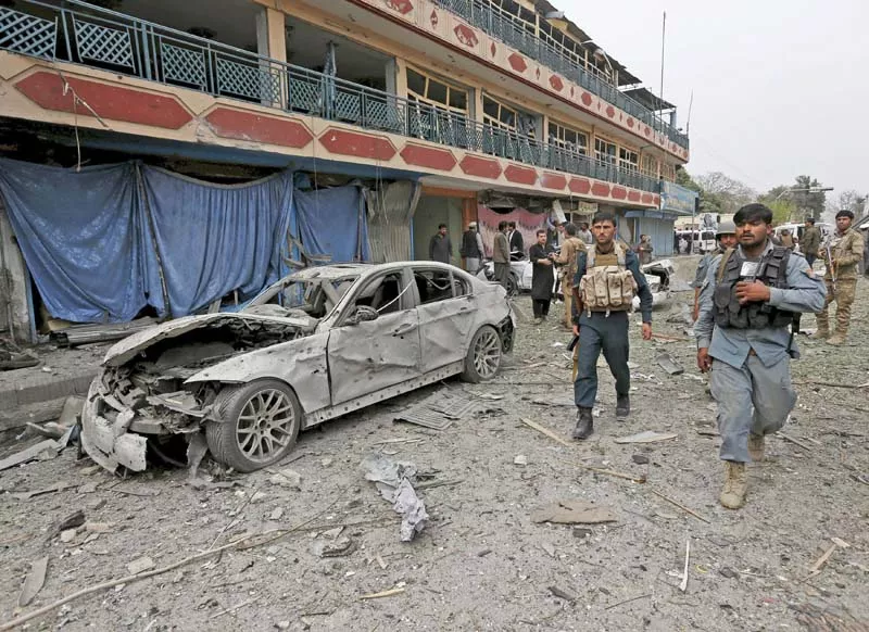 policemen inspect the site of a blast near the indian consulate in jalalabad photo reuters policemen inspect the site of a blast near the indian consulate in jalalabad photo reuters