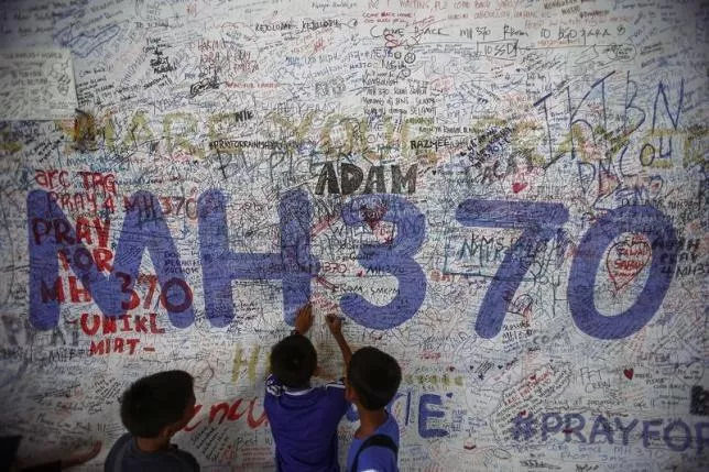 children write messages of hope for passengers of missing malaysia airlines flight mh370 at kuala lumpur international airport photo reuters children write messages of hope for passengers of missing malaysia airlines flight mh370 at kuala lumpur international airport photo reuters